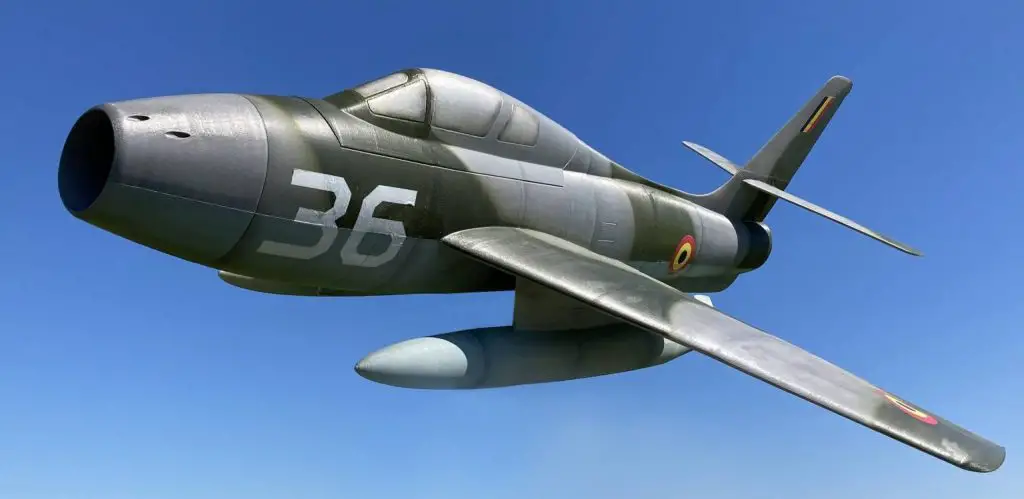 The 3D printed, F-84 Thunderstreak jet soaring across a blue sky