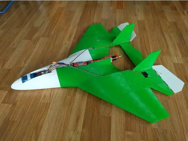 The SuperNova 3D printed plane, photographed on a wood floor