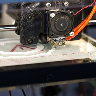 A 3d printer putting down the first layer