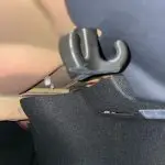 A 3d printed bag hook inside of a Tesla